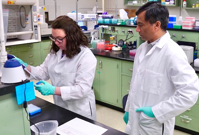 M. Hashim Raza and Erin Andres in the genetics laboratory